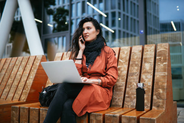 istock young woman working on the go in Berlin 1156152991