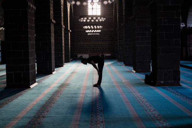 istock The man who makes prayer in the mosque 1156154217