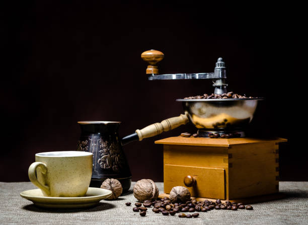 istock coffee cup with a cezve and coffee grinder with coffee beans and nuts on a dark background 1156157653