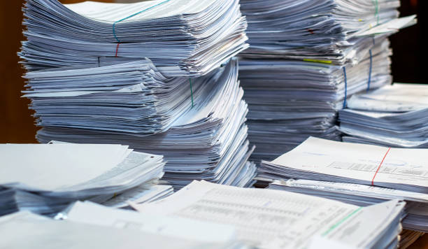 istock pile of paper documents in the office 1156160741
