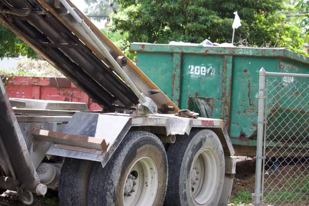 istock Roll-off dumpster and truck 1156160858