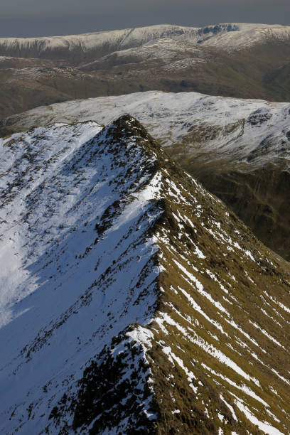 Striding Edge, Helvellyn Striding Edge, a glacial arête at Helvellyn Mountain in the English Lake District, striding edge stock pictures, royalty-free photos & images