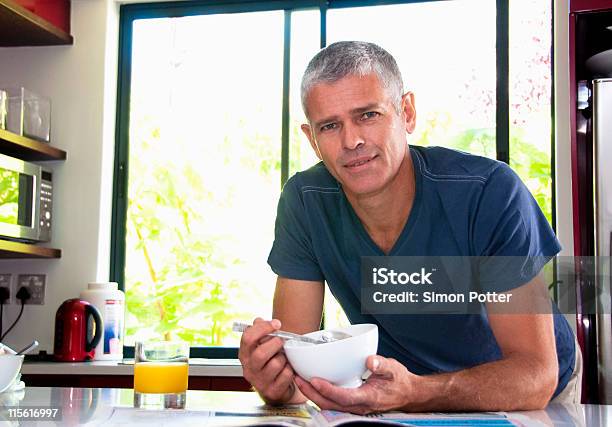 Home Owner At Breakfast Stock Photo - Download Image Now - Bowl, Men, Eating