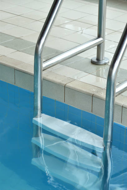istock Swimming Pool Ladder Close Up Abstract 1156170137