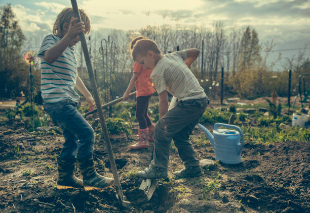 istock Children gardening 1156171206