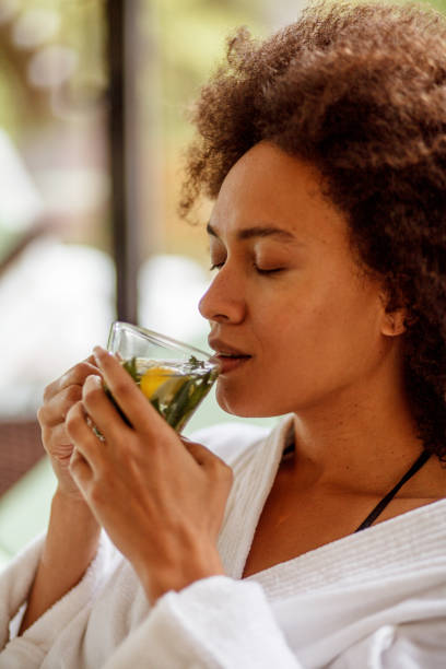 istock Young woman enjoying herbal tea 1156171341