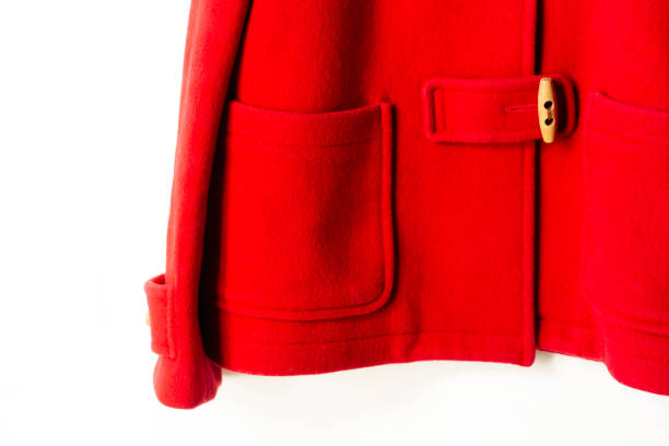 istock red wool coat hanging on clothes hanger on white background 1156180367