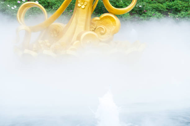Water mist and golden sculpture