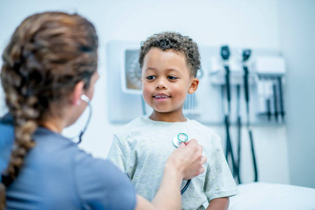 istock Little boy at medical appointment 1156198905