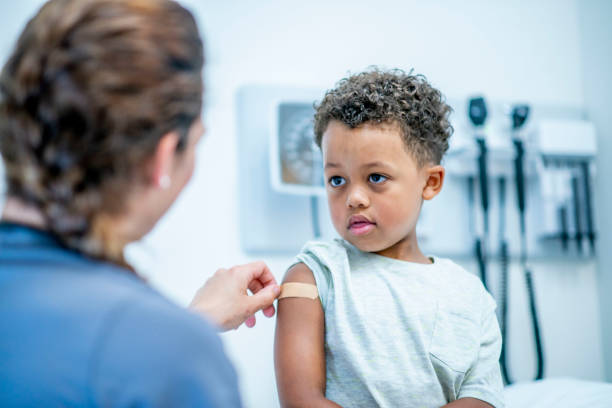 istock Little boy at medical appointment 1156198915