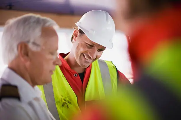 Photo of Captain talking to workers