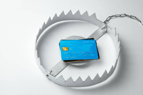 istock Trap with stack of credit cards. Unsafe credit risk. Gray background. 1156204817