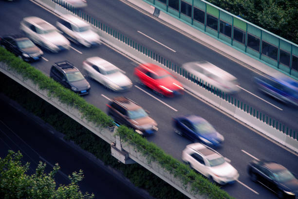 istock Car driving on an elevated road 1156205525