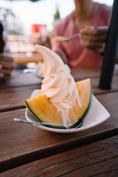 Cantaloupe melon topped with soft service ice cream and red bean paste
