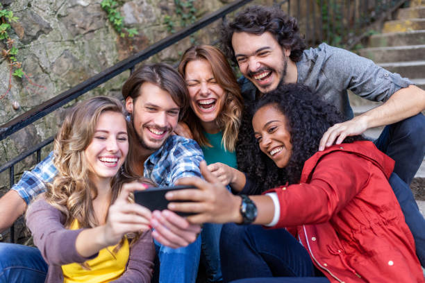 istock International friends taking selfie 1156207479