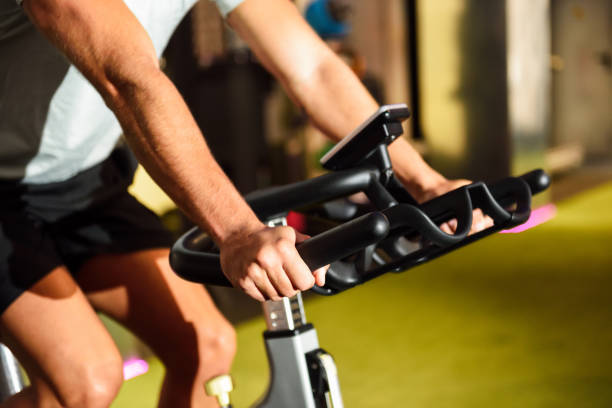 istock Hands of a man training at a gym doing cyclo indoor. 1156207602
