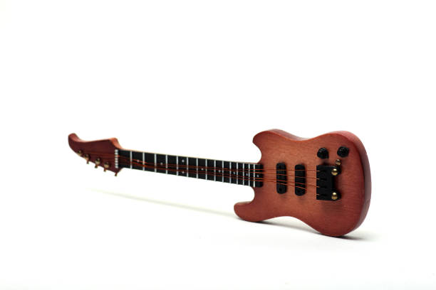 istock bass guitar isolated on white background 1156209060