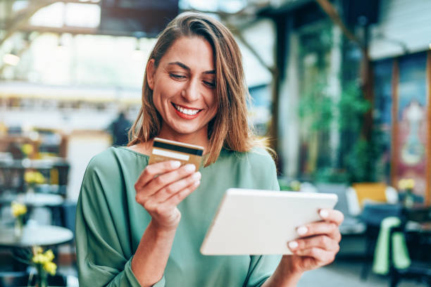 istock Young woman shopping online 1156210229