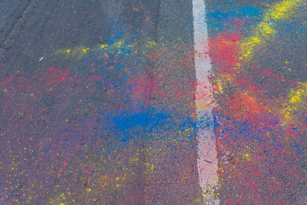 istock Colorful Holi powder scattered on a road 1156212364