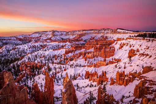 Bryce Canyon National Park, a sprawling reserve in southern Utah, is known for crimson-colored hoodoos, which are spire-shaped rock formations