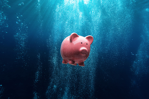Piggy bank underwater: concept for cash investment loss