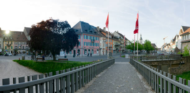 the historic city center in the Swiss village of Bulle in canton Fribourg Bulle, FR / Switzerland - 1 June 2019: the historic city center in the Swiss village of Bulle in canton Fribourg bulle stock pictures, royalty-free photos & images