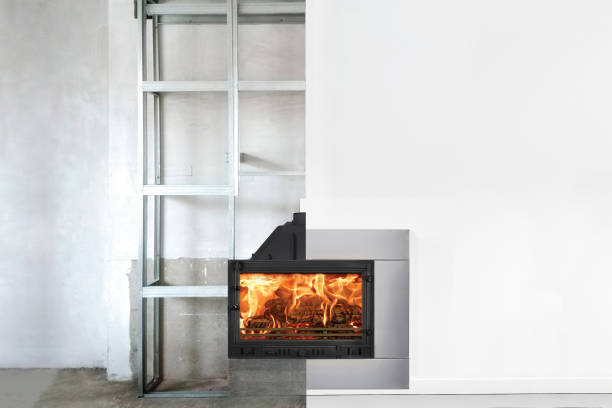 istock Process installation of fireplace insert in living room. Two steps 1156214498