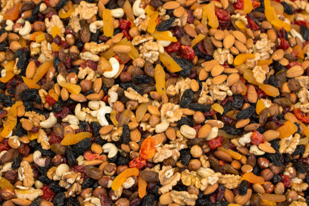 istock Pile of assorted nuts and seeds on display 1156215751