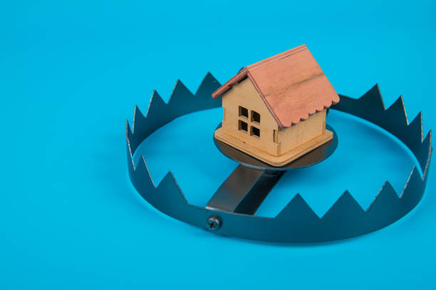 istock A house in trap. Concept risk in real estate. security. Copy space 1156216410