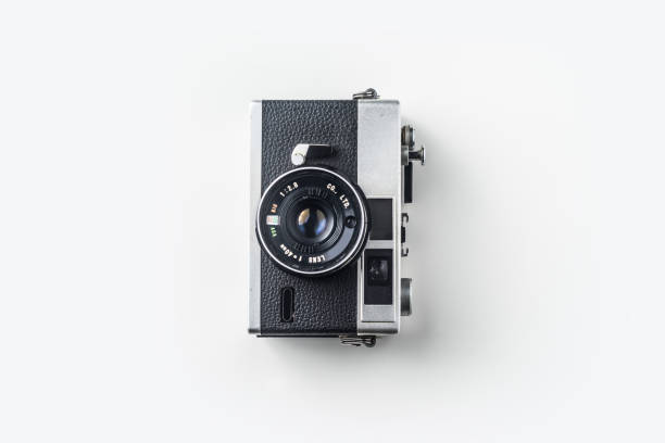 istock Top view of vintage cameras on white background 1156218306