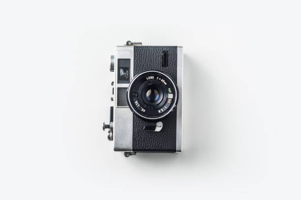 Top view of vintage cameras on white background