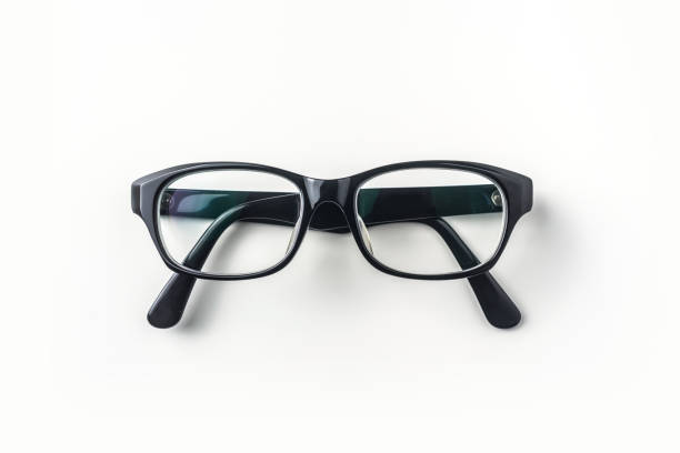 Top view of vintage glasses on white background desk for mockup