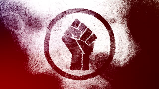 Red raised fist symbol on a high contrasted grungy and dirty, animated, distressed and smudged 4k video background with swirls and frame by frame motion feel with street style for the concepts of solidarity,support,human rights,worker rights,strength