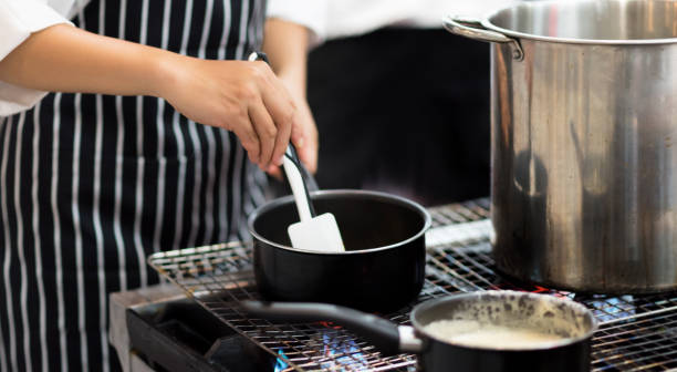 istock Chef cooking food in the kitchen, Chef preparing food 1156219432
