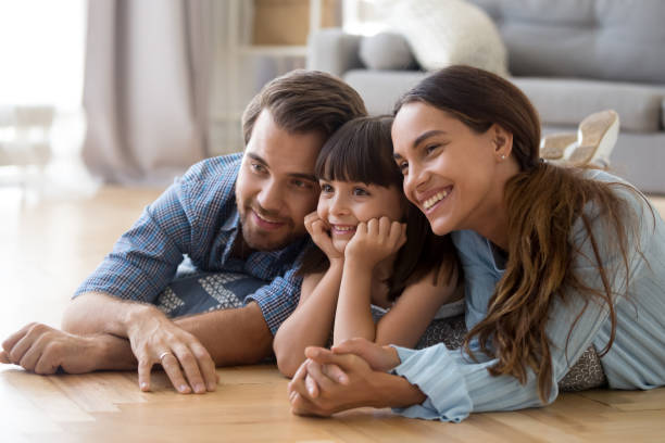 istock Happy parents posing making picture with little daughter 1156224815
