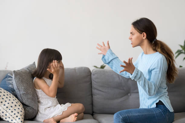 istock Angry young mom gesture arguing with little kid 1156224858
