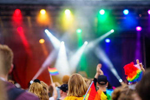 Music Event on PRIDE Festival with colourful flags and spotlights, LGBT