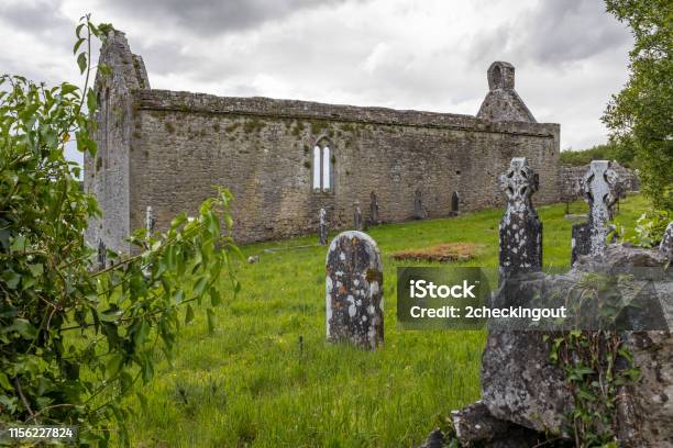A View Through Grave Stone And Foliage Of The Abanoned Ruins Of Killone Abbey That Was Built In 1190 And Sits On The Banks Of The Killone Lake Just Outside Ennis County Clare Stock Photo - Download Image Now