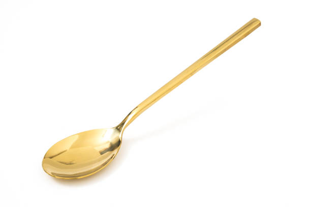 istock golden spoon isolated on a white background 1156234037