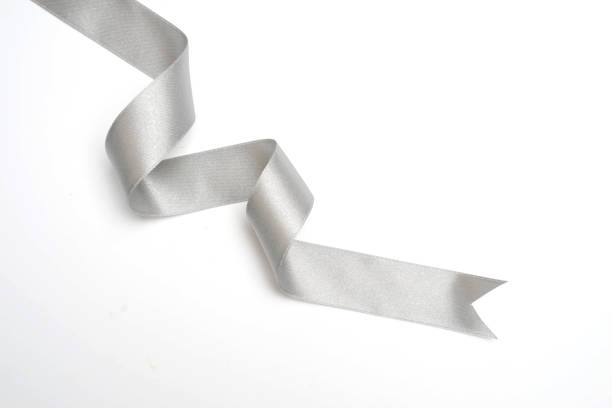 istock Silver ribbon in roll on white background 1156234041