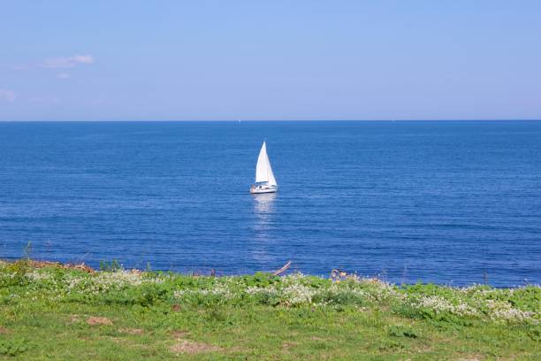 istock Small sailing boat at sea 1156234977