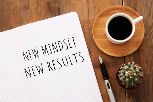 istock top view image of table with open notebook and the text new mindset new results. success and personal development concept 1156235132