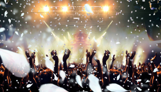 istock Petals falling on a concert crowd 1156236025