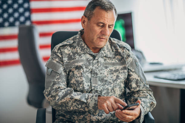 istock Senior soldier using smart phone 1156236074