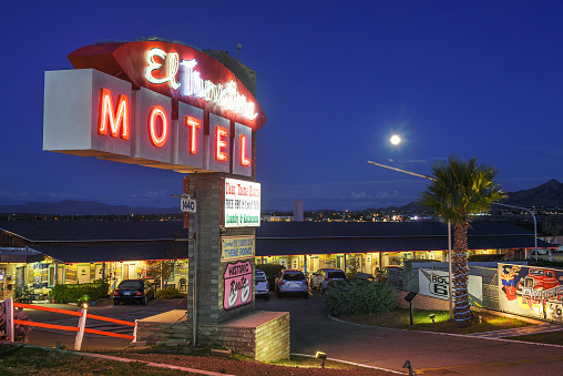 Kingman, Arizona, USA - October 24, 2018 : El Trovatore Motel with famous neon sign located on historic Route 66 in Arizona at night.
