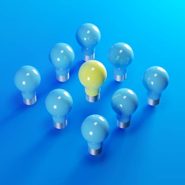 istock yellow light bulb among blue light bulbs on blue backgound. minimal idea concept. 3D Render. 1156238933