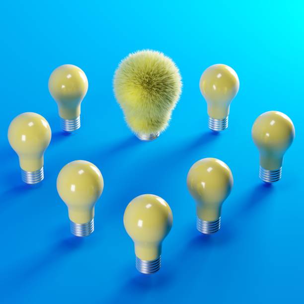 istock yellow fur light bulb floating among yellow light bulbs on blue backgound. minimal idea concept. 3D Render. 1156238939