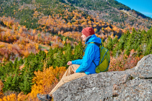 istock Backpacker man at Artist's Bluff in autumn 1156238994