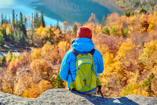 istock Backpacker man at Artist's Bluff in autumn 1156239001