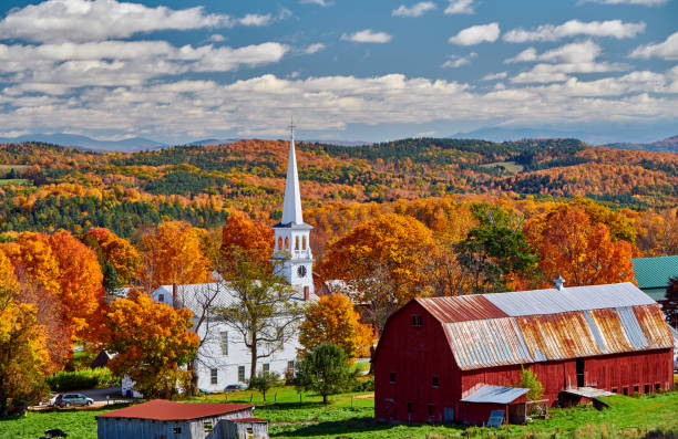 istock Church and farm with red barn at autumn 1156239052